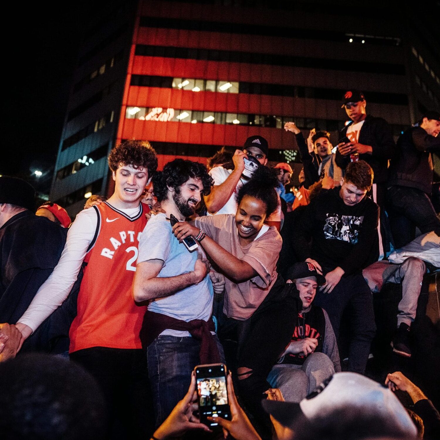 young-people-celebrate-Canadian-basketball-victory-in-downtown-Toronto