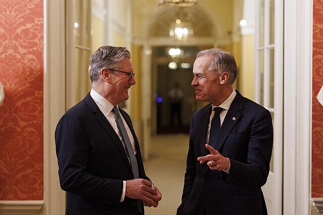 Sir Keir Starmer and Mark Carney converse in London