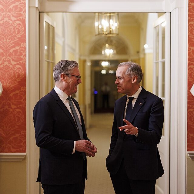Sir Keir Starmer and Mark Carney converse in London