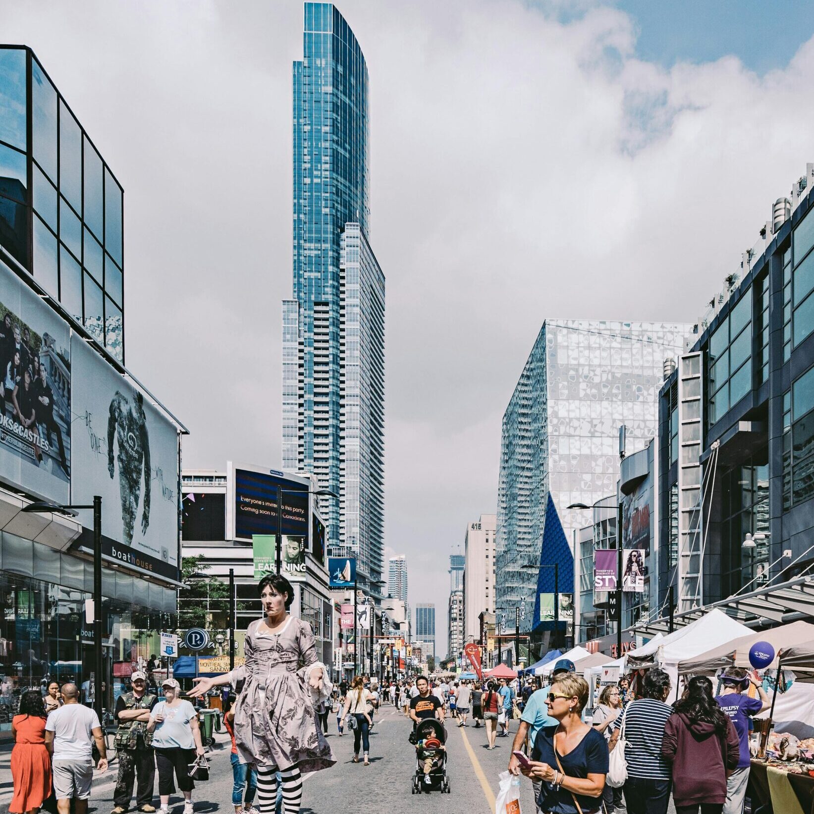 Bustling market with street performers in Toronto Canada